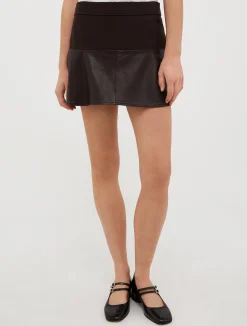 Jersey and leather mini skirt